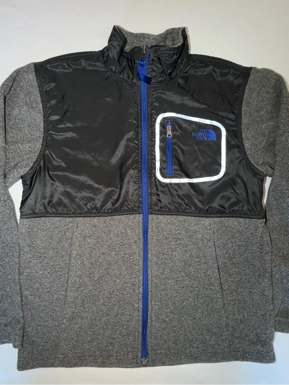 The North Face Kids Black and Gray Jacket with Blue Zip. C13,EMP